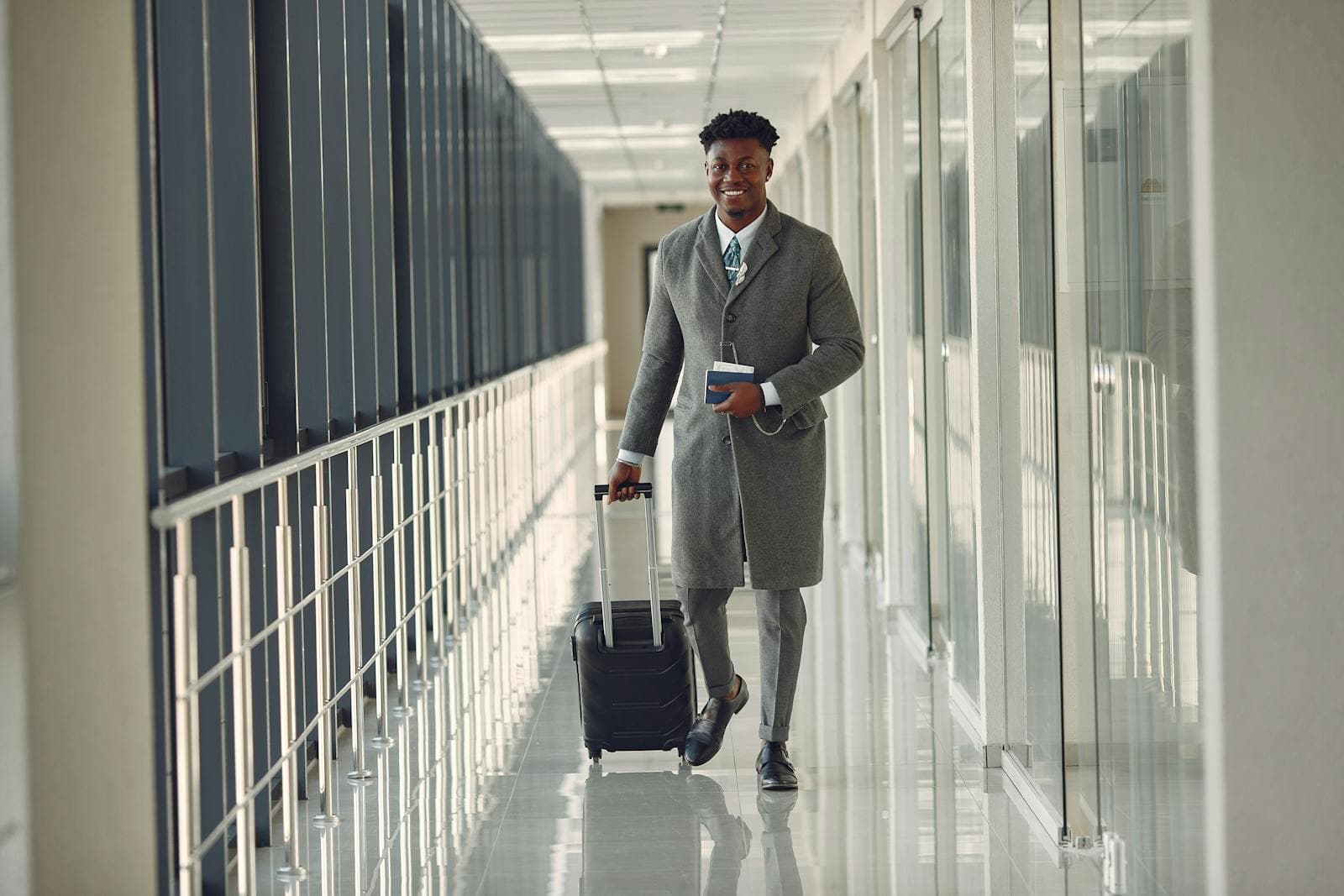 Business traveler moving with carry-on luggage during a convention trip
